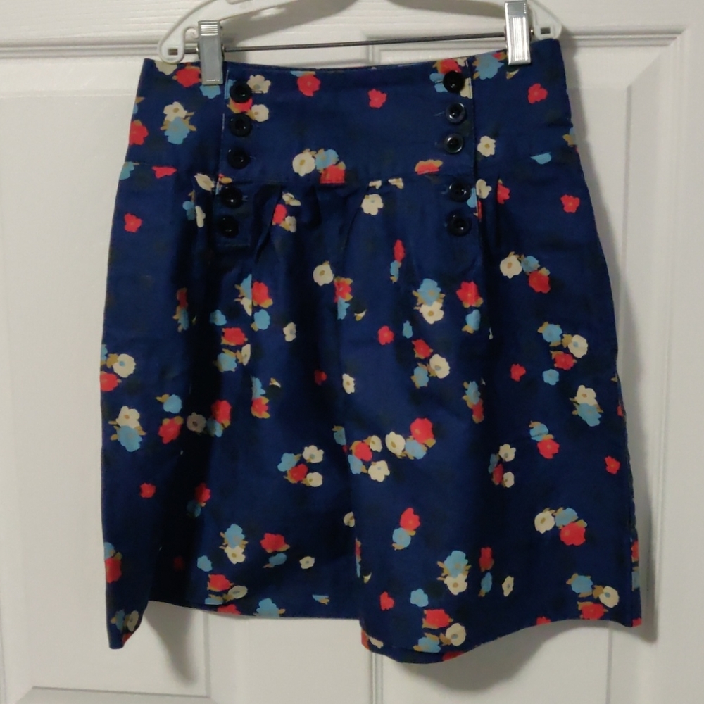 Super cute button front flower and polka dot skirt